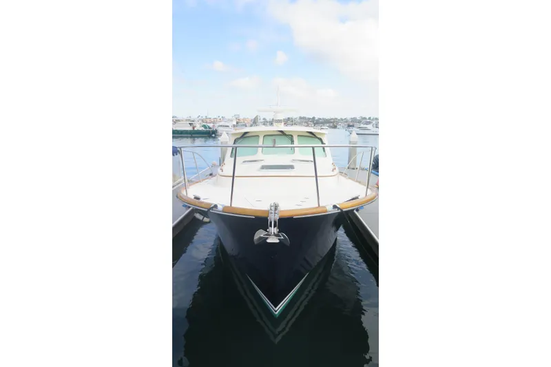 Slide: The Image of 2007 Hinckley Talaria 40 yacht docked at marina, front view. - 11