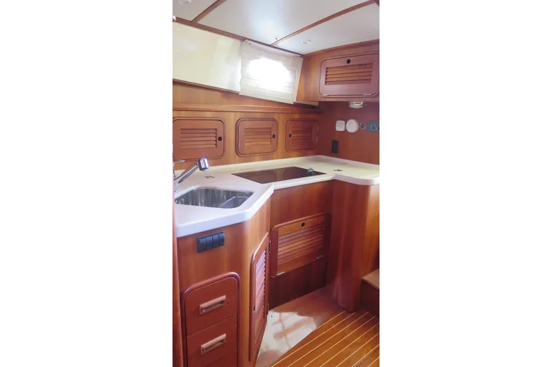Slide: The Image of Luxurious wooden interior of 2007 Hinckley Talaria 40 yacht kitchen area. - 22