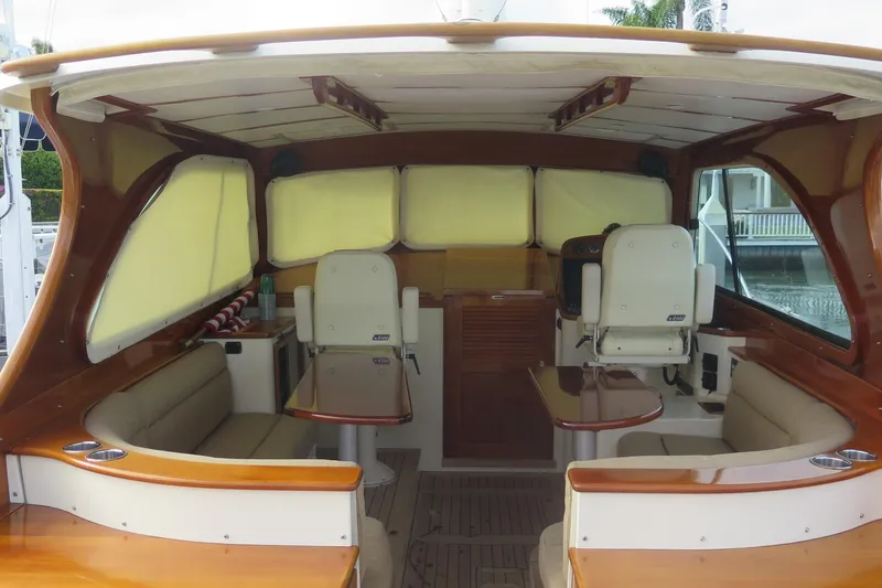 Slide: The Image of Interior of a 2007 Hinckley Talaria 40 yacht with seating and helm station. - 28