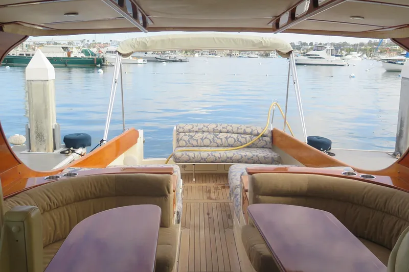 Slide: The Image of Luxurious 2007 Hinckley Talaria 40 yacht interior with elegant seating and scenic marina view. - 30