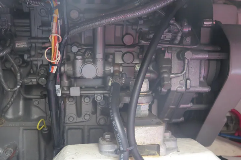 Slide: The Image of Engine components of a 2007 Hinckley Talaria 40, showcasing wiring and mechanical parts. - 38