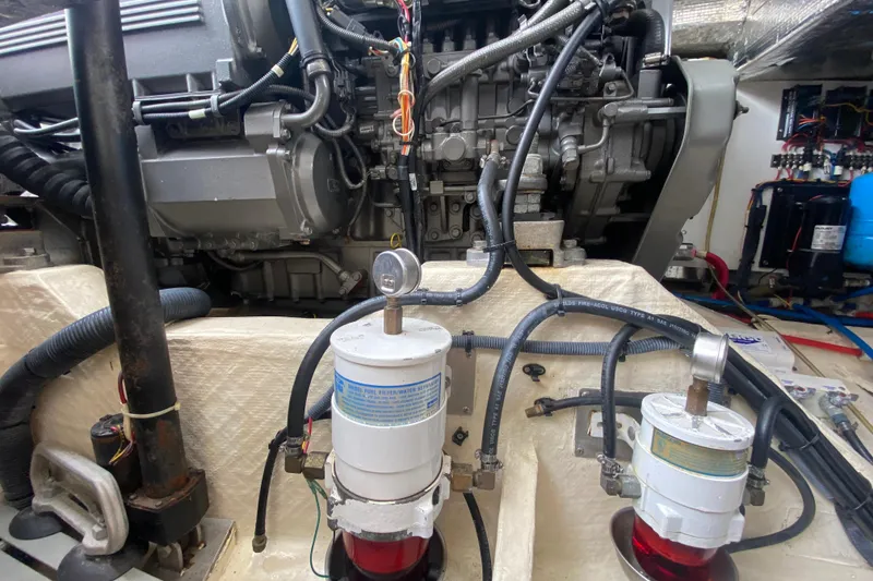 Slide: The Image of Engine room of a 2007 Hinckley Talaria 40, showcasing mechanical components and fuel filters. - 45