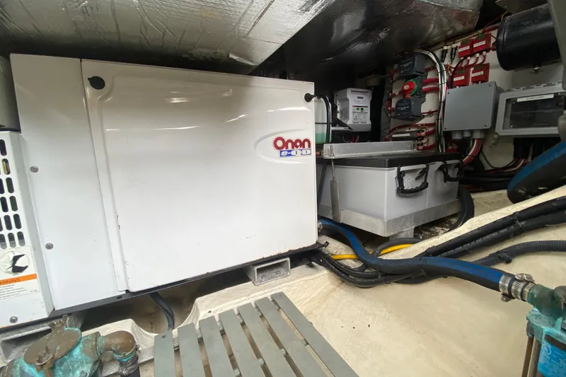 Slide: The Image of Engine room of 2007 Hinckley Talaria 40 with Onan generator and electrical components. - 50