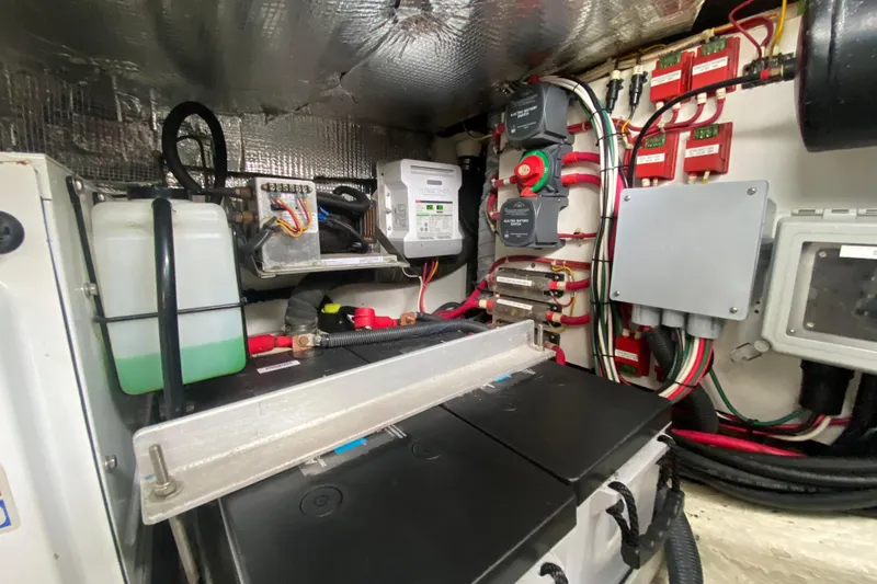Slide: The Image of Starboard forward mechanical space: battery charger / equalizer, DC disconnects and breakers, engine start batteries - 51