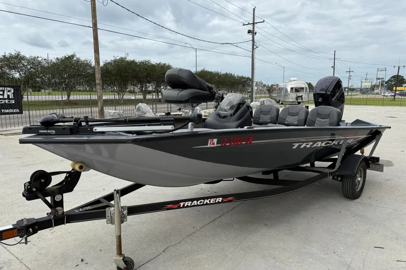 Slide: The Image of 2021 Tracker Pro Team 175 TF fishing boat on trailer, parked outdoors. - 3