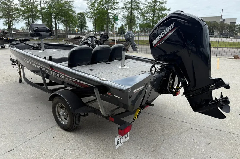 Slide: The Image of 2021 Tracker Pro Team 175 TF fishing boat with Mercury outboard motor on trailer. - 4