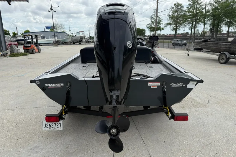 Slide: The Image of 2021 Tracker Pro Team 175 TF boat with outboard motor, parked on a trailer. - 5