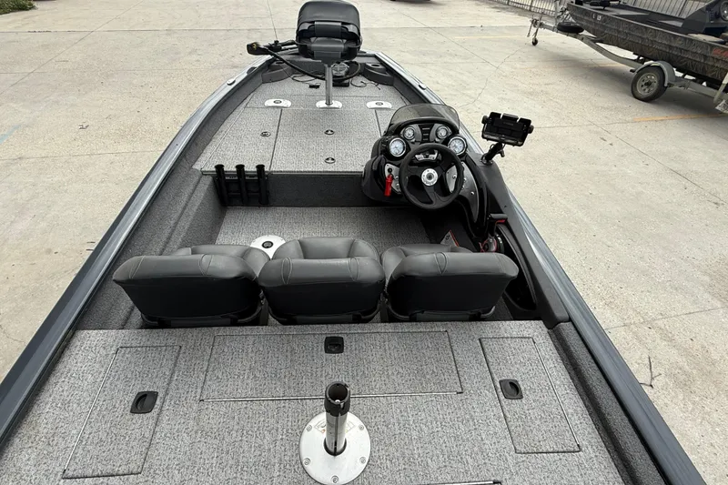Slide: The Image of 2021 Tracker Pro Team 175 TF boat interior with steering console and seating. - 7