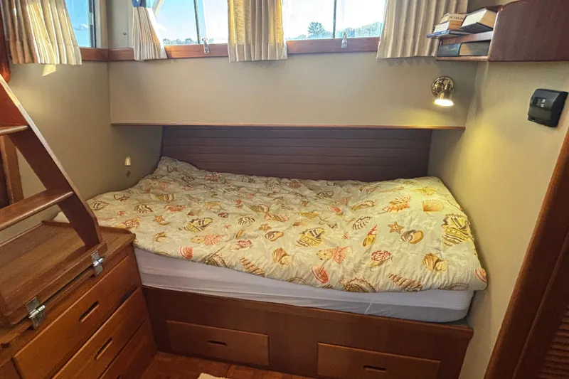 Slide: The Image of Cozy cabin interior of 1989 Grand Banks 46 Classic with nautical-themed bedding. - 103