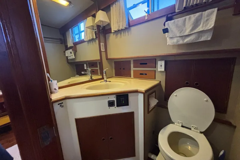 Slide: The Image of Bathroom interior of 1989 Grand Banks 46 Classic yacht, featuring sink and toilet. - 106