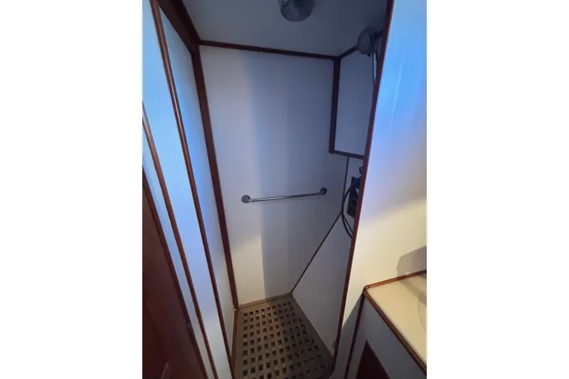 Slide: The Image of Shower area in 1989 Grand Banks 46 Classic yacht with wooden accents. - 126