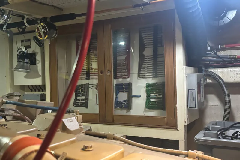 Slide: The Image of Engine room of 1989 Grand Banks 46 Classic with organized wiring and equipment. - 143