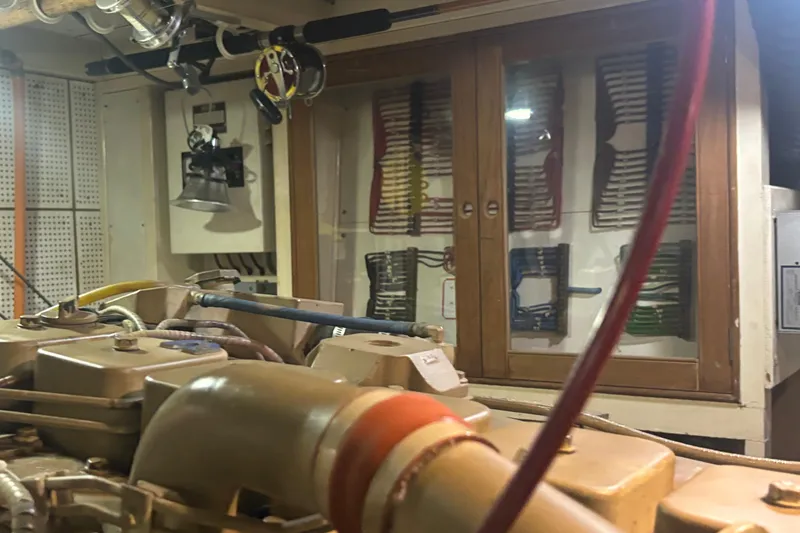 Slide: The Image of Engine room of 1989 Grand Banks 46 Classic yacht with organized wiring and equipment. - 144