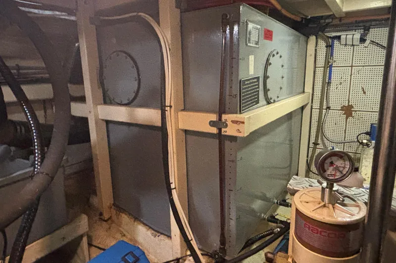 Slide: The Image of Engine room of 1989 Grand Banks 46 Classic yacht, featuring machinery and gauges. - 147