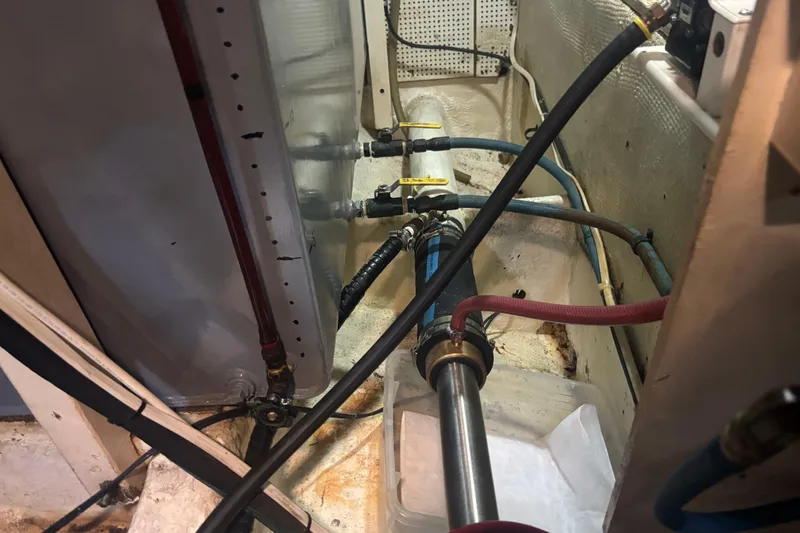 Slide: The Image of Engine room of 1989 Grand Banks 46 Classic with visible pipes and fittings. - 151