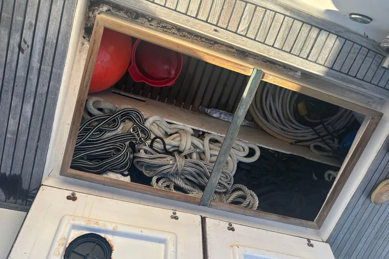 Slide: The Image of Storage compartment on 1989 Grand Banks 46 Classic boat with ropes and equipment. - 22