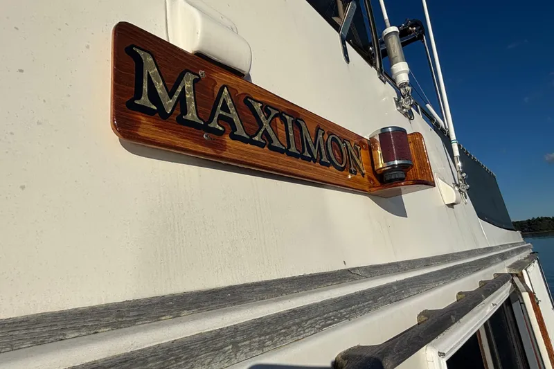 Slide: The Image of 1989 Grand Banks 46 Classic boat with "Maximon" nameplate and exterior details. - 37