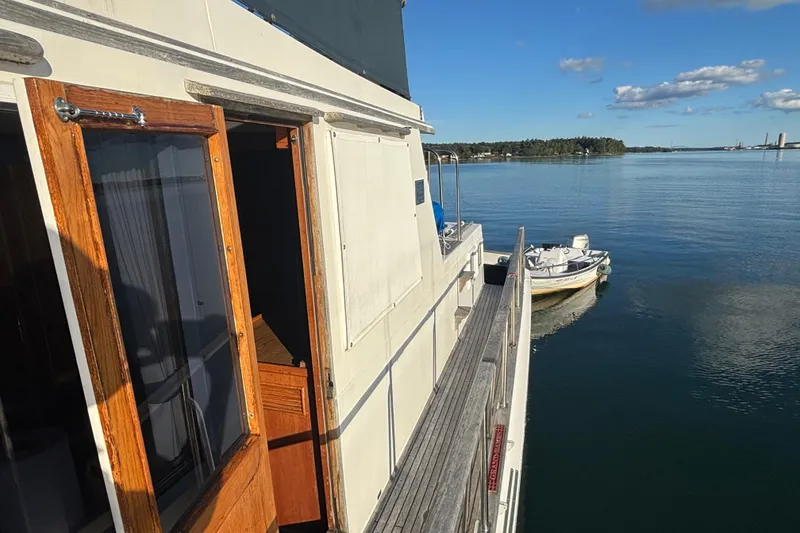 Slide: The Image of 1989 Grand Banks 46 Classic yacht on calm water with clear sky. - 38