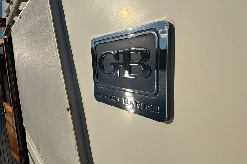 Slide: The Image of 1989 Grand Banks 46 Classic yacht emblem on exterior wall. - 40