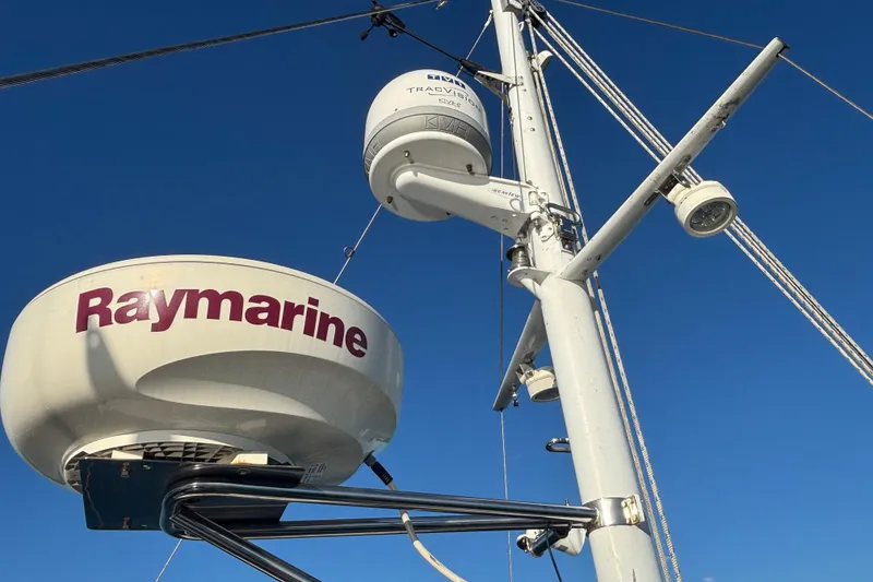 Slide: The Image of Radar equipment on 1989 Grand Banks 46 Classic yacht against clear blue sky. - 56