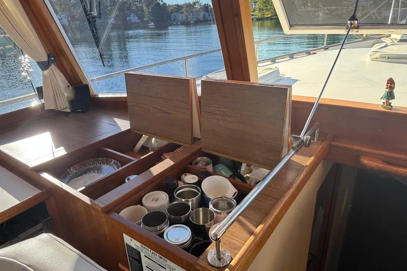 Slide: The Image of Interior of 1989 Grand Banks 46 Classic yacht with open storage compartments. - 70