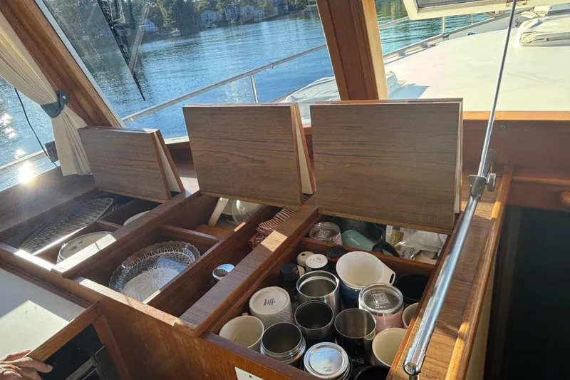 Slide: The Image of Interior view of 1989 Grand Banks 46 Classic yacht with open storage compartments. - 72