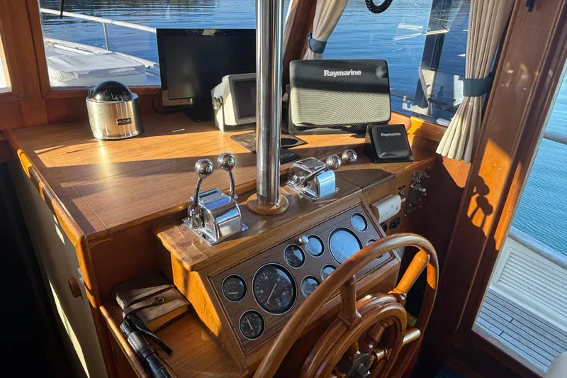 Slide: The Image of Helm of 1989 Grand Banks 46 Classic yacht with Raymarine navigation equipment. - 73