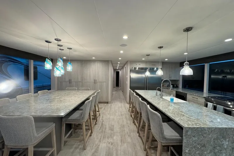 Slide: The Image of Luxurious 2022 Adonia Layin' Low kitchen with modern design and elegant lighting fixtures. - 22