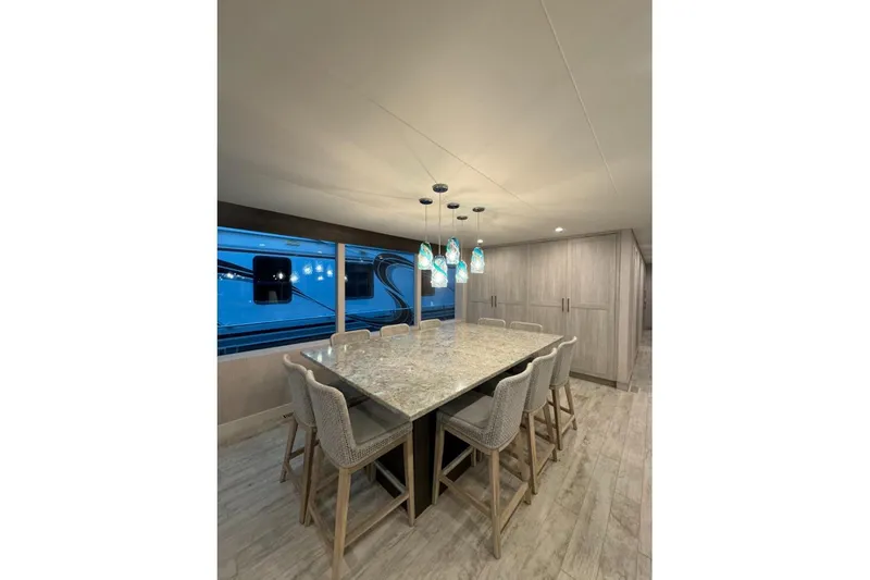 Slide: The Image of Luxurious dining area in 2022 Adonia Layin' Low with elegant lighting and modern decor. - 23