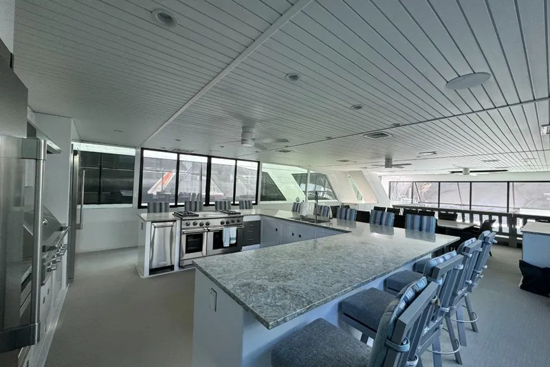 Slide: The Image of Luxurious 2022 Adonia Layin' Low yacht interior with modern kitchen and spacious seating area. - 25