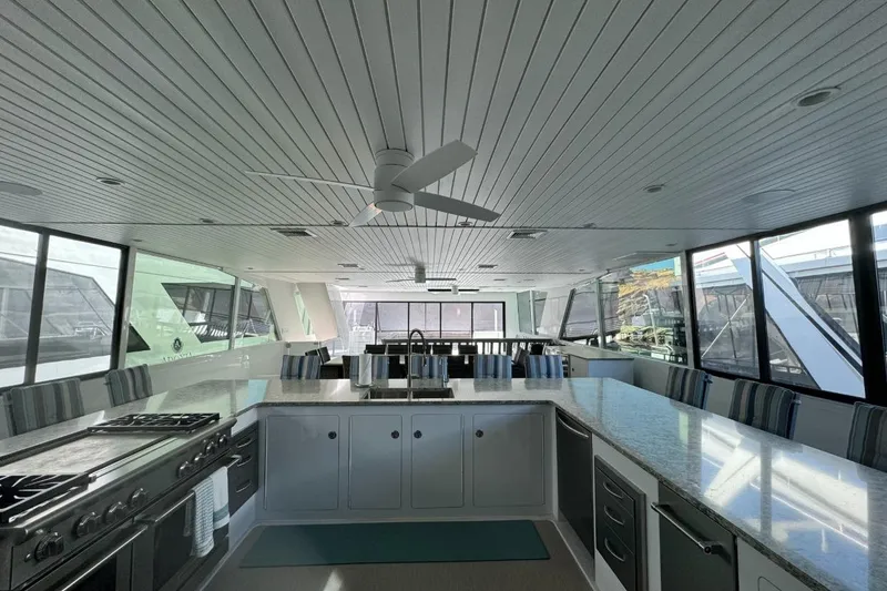 Slide: The Image of Luxurious 2022 Adonia Layin' Low yacht interior with modern kitchen and panoramic windows. - 26