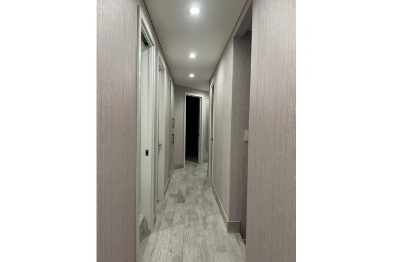 Slide: The Image of Modern hallway in Adonia Layin' Low 2022 model, featuring sleek design and lighting. - 7