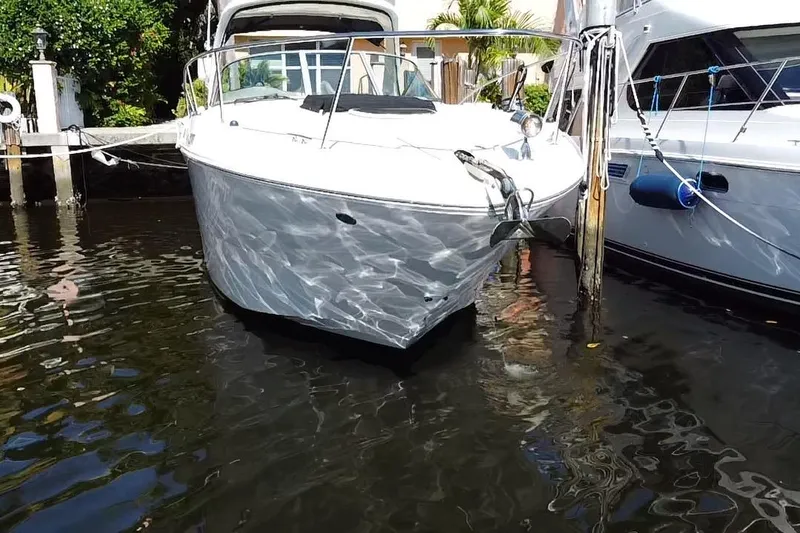 Slide: The Image of 2012 Sea Ray 330 Sundancer yacht docked in sunny marina. - 2