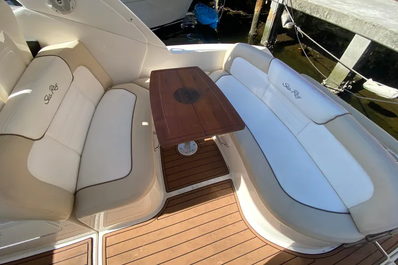 Slide: The Image of Luxurious seating area on 2012 Sea Ray 330 Sundancer yacht with wooden table. - 21