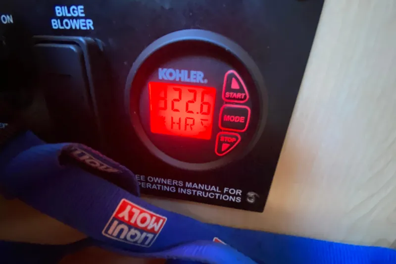 Slide: The Image of Kohler generator display showing 322.6 hours on a 2012 Sea Ray 330 Sundancer boat. - 35