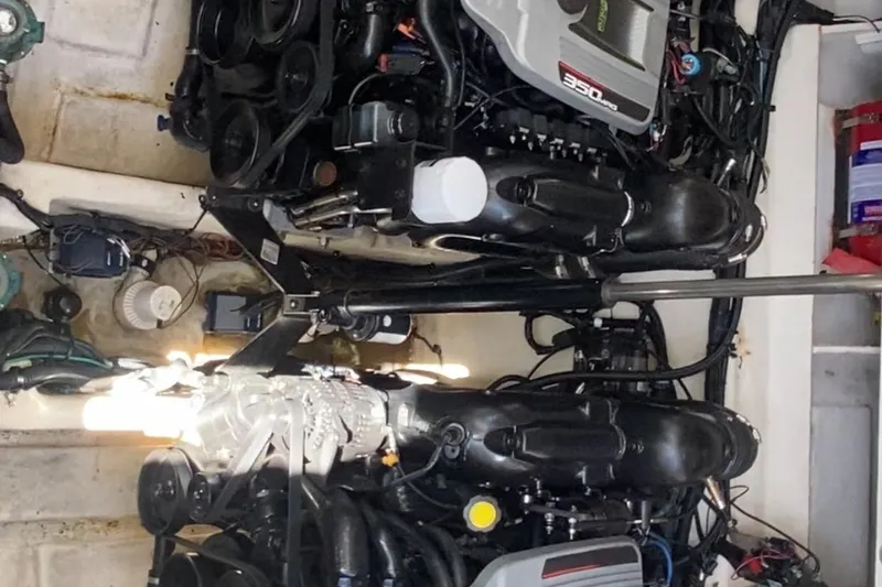 Slide: The Image of Engine compartment of a 2012 Sea Ray 330 Sundancer boat, showcasing dual engines. - 39