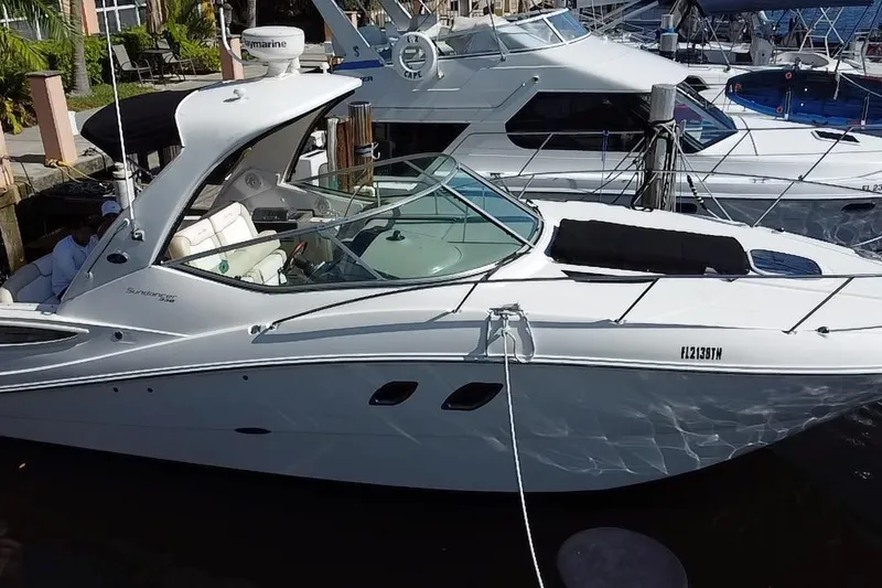 Slide: The Image of 2012 Sea Ray 330 Sundancer yacht docked at marina, side view. - 8