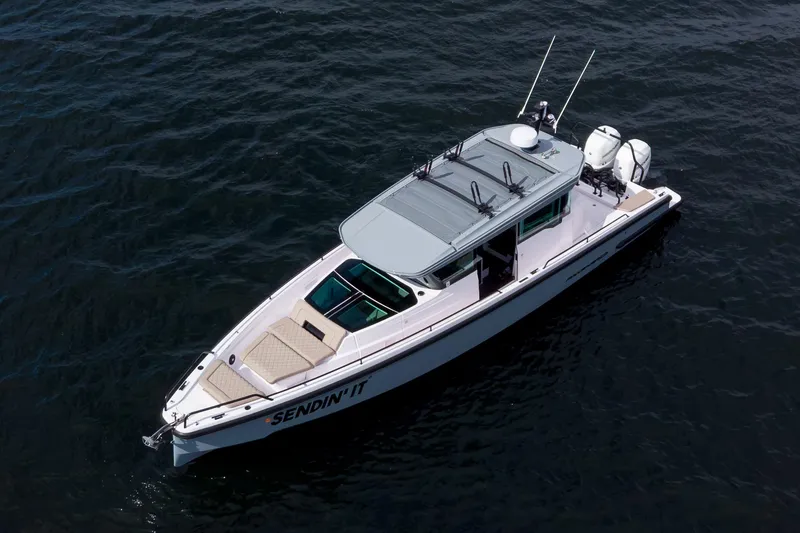 The Image of 2022 Axopar 37 XC Cross Cabin boat on water, aerial view. - 1