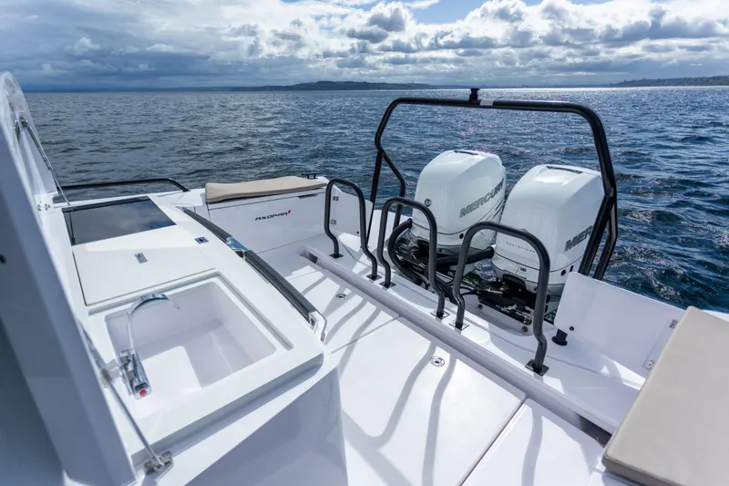 Slide: The Image of 2022 Axopar 37 XC Cross Cabin with dual Mercury outboard engines on open water. - 21