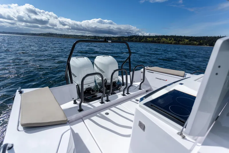 Slide: The Image of 2022 Axopar 37 XC Cross Cabin on water, featuring dual Mercury engines. - 23
