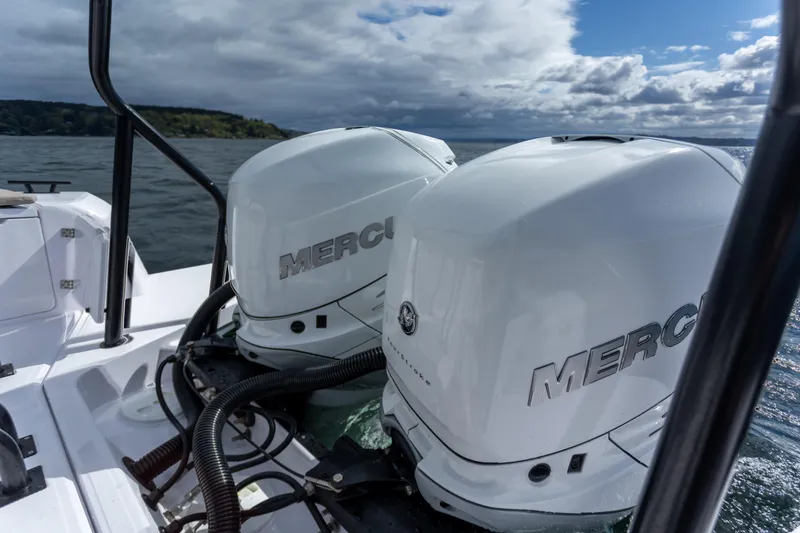 Slide: The Image of Twin Mercury outboard engines on a 2022 Axopar 37 XC Cross Cabin boat. - 25