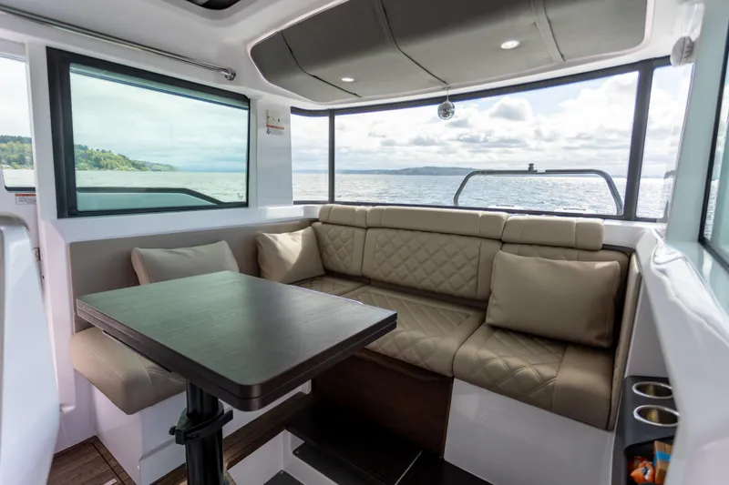 Slide: The Image of Luxurious interior of 2022 Axopar 37 XC Cross Cabin with scenic ocean view. - 26