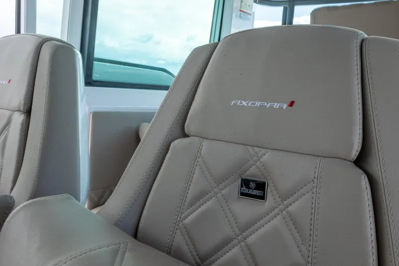 Slide: The Image of Luxurious seating in the 2022 Axopar 37 XC Cross Cabin with Brabus detailing. - 30