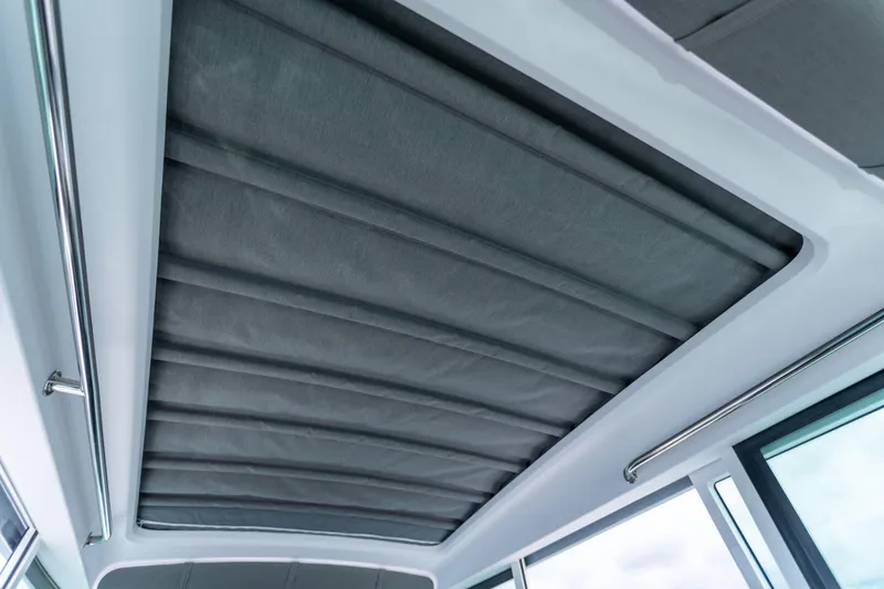 Slide: The Image of Interior roof view of 2022 Axopar 37 XC Cross Cabin with sleek design. - 36