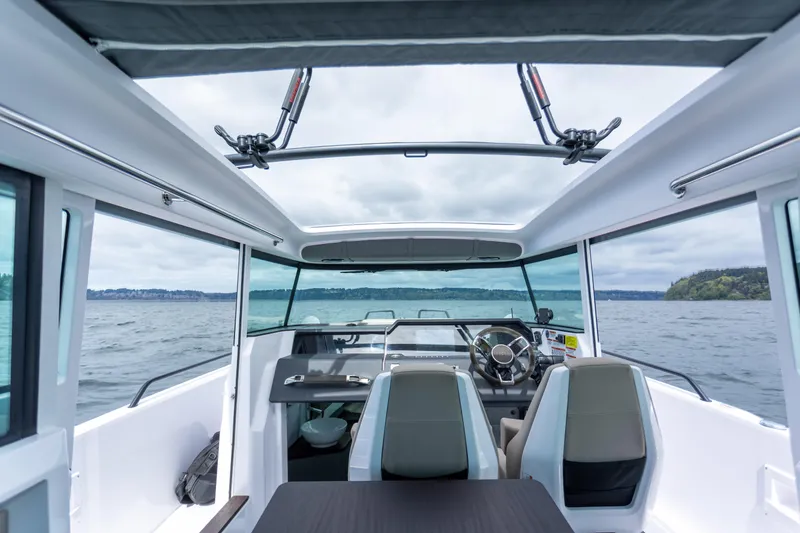 Slide: The Image of Interior view of 2022 Axopar 37 XC Cross Cabin on open water. - 38