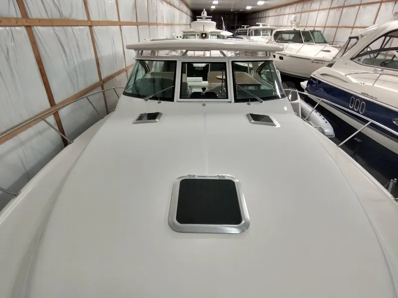 Slide: The Image of 2001 Tiara Yachts 3800 Open in storage facility, front view. - 11
