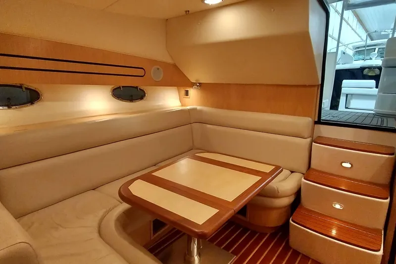 Slide: The Image of Interior of 2001 Tiara Yachts 3800 Open with cozy seating area. - 14