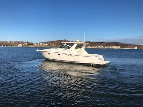 Slide: The Image of 2001 Tiara Yachts 3800 Open on calm water. - 3