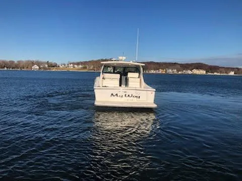 Slide: The Image of 2001 Tiara Yachts 3800 Open on calm water. - 5