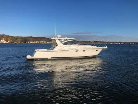 Slide: The Image of 2001 Tiara Yachts 3800 Open on calm water. - 6